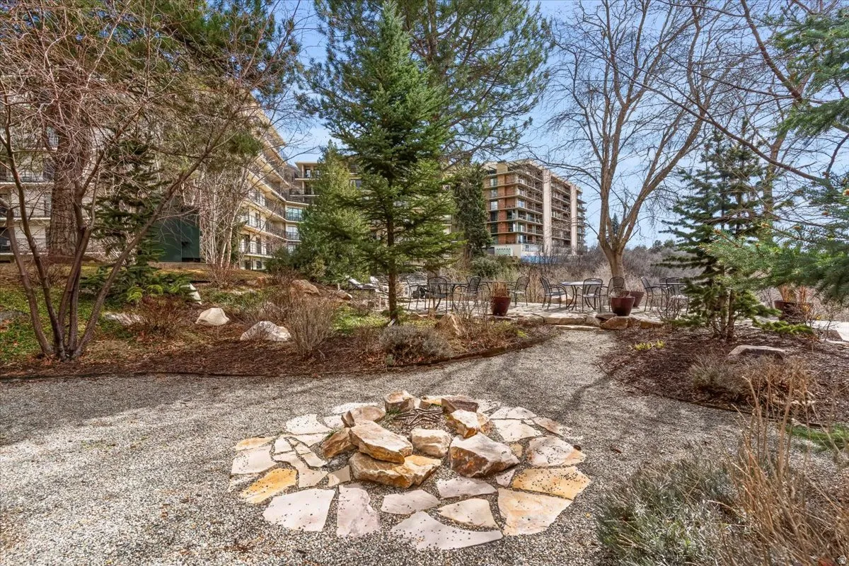 View of yard featuring a communal outdoor patio