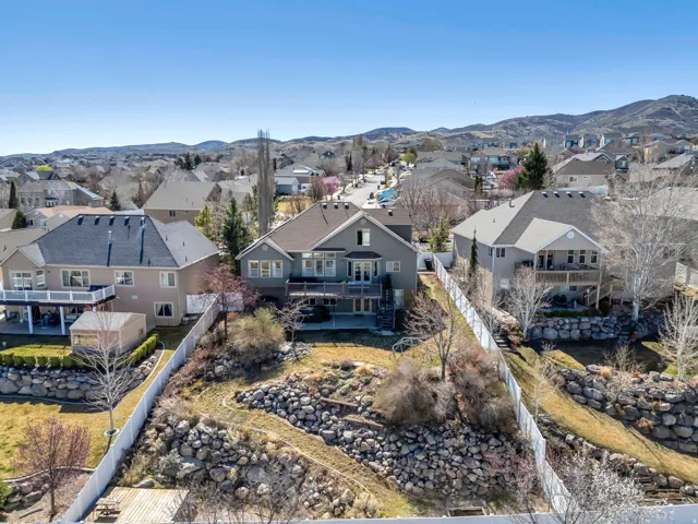 Aerial perspective of suburban area featuring a mountain backdrop