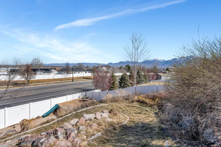 View of mountain backdrop featuring nearby suburban area