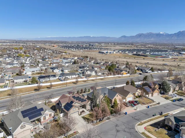 Aerial perspective of suburban area featuring a mountain backdrop