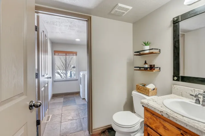 Half bath right off garage, leading to laundry room