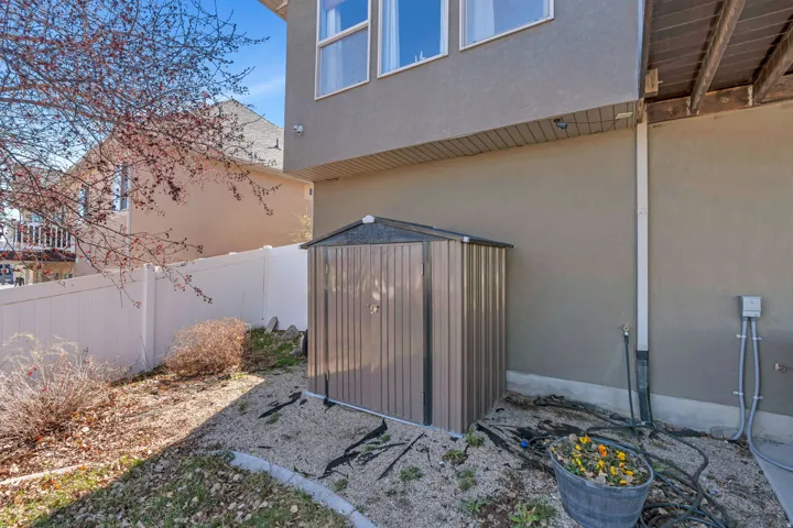 View of shed featuring a fenced backyard