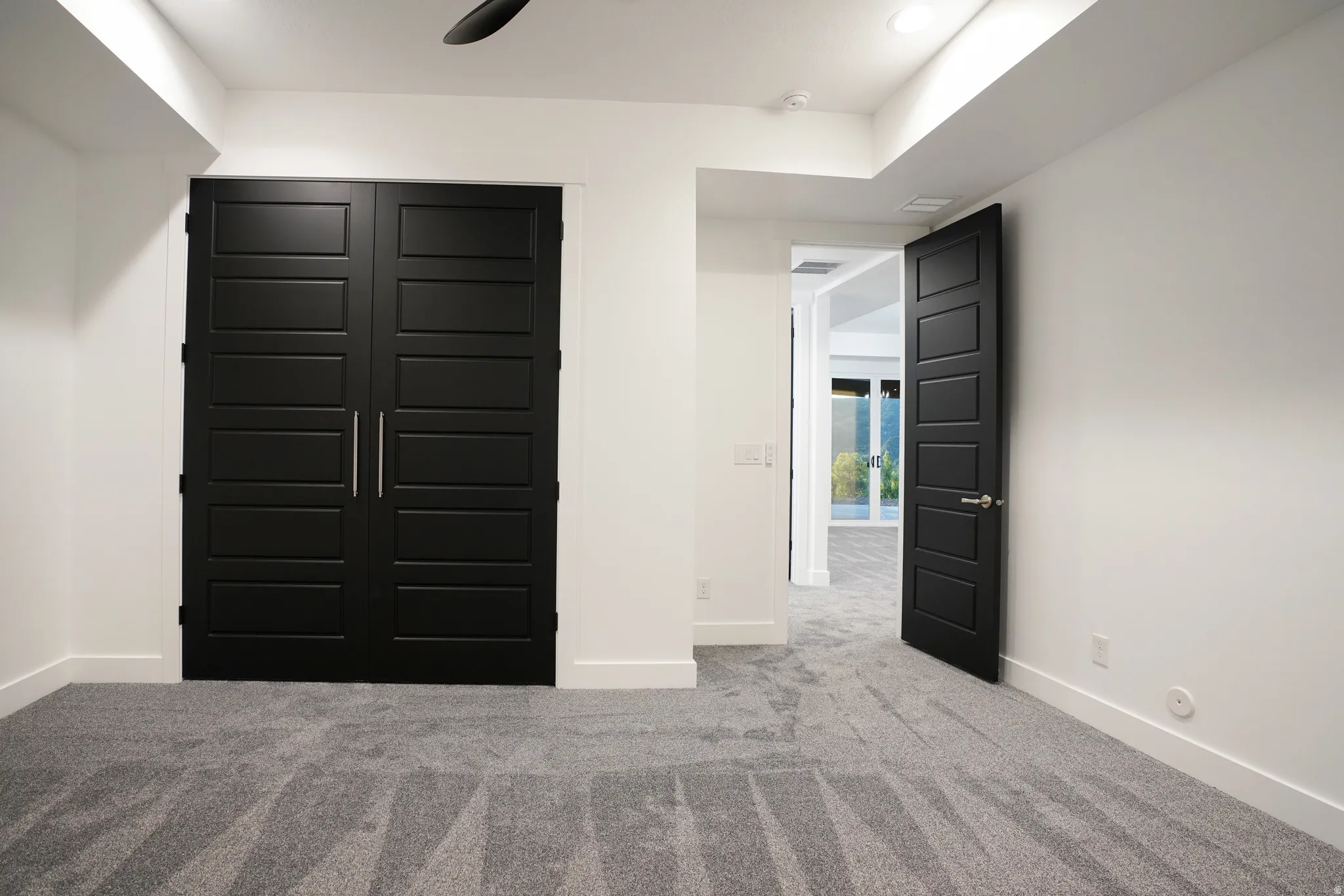 Unfurnished bedroom featuring carpet and a closet