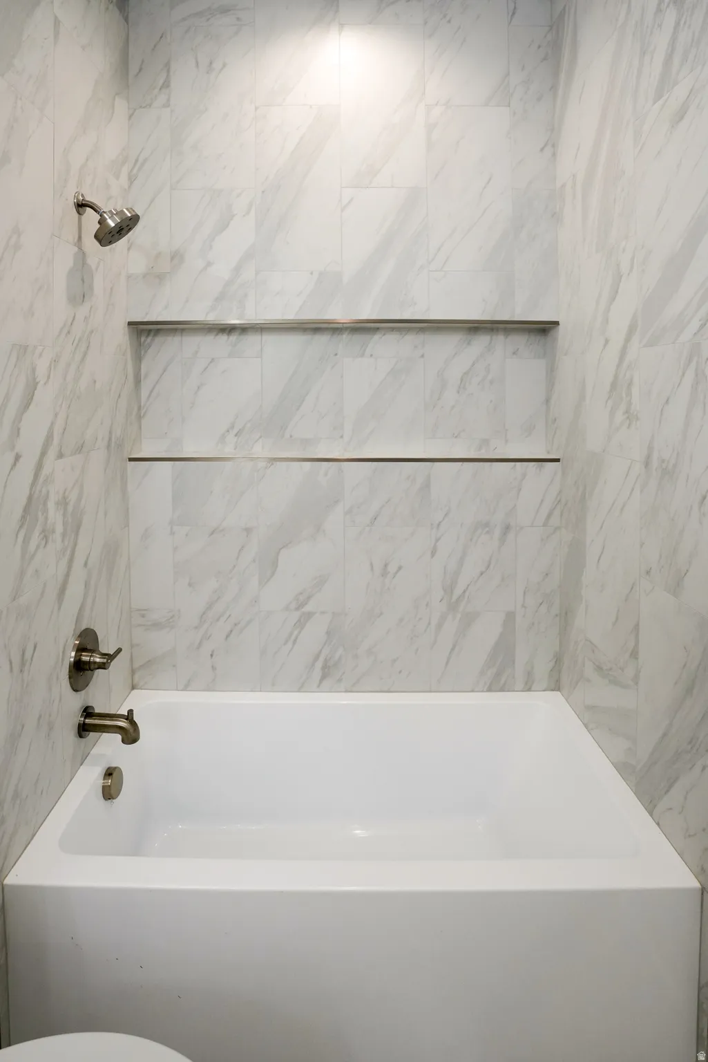 Bathroom featuring bathing tub / shower combination