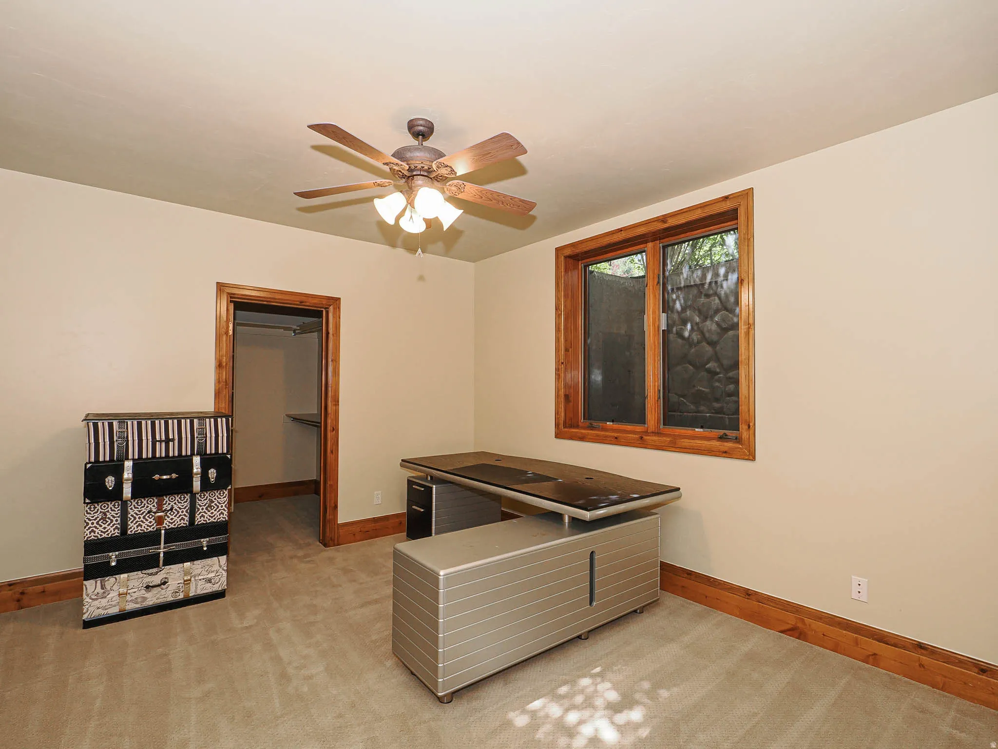 Playroom featuring light colored carpet and a ceiling fan