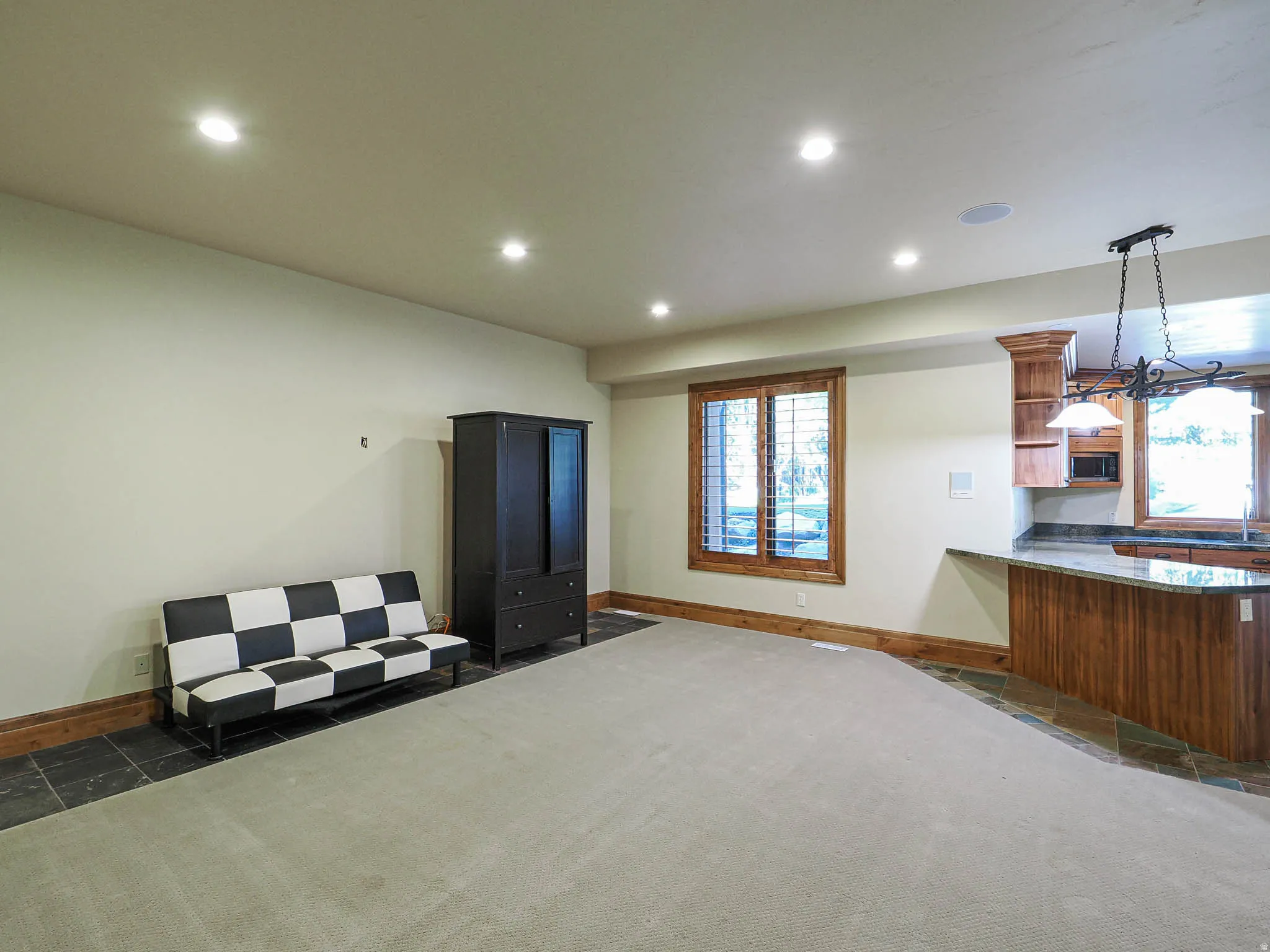 Bedroom featuring multiple windows, recessed lighting, and dark colored carpet