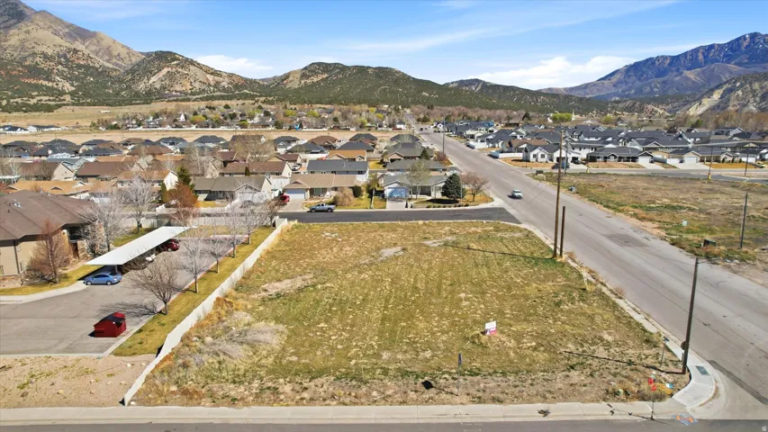 View of property location featuring nearby suburban area and a mountainous background