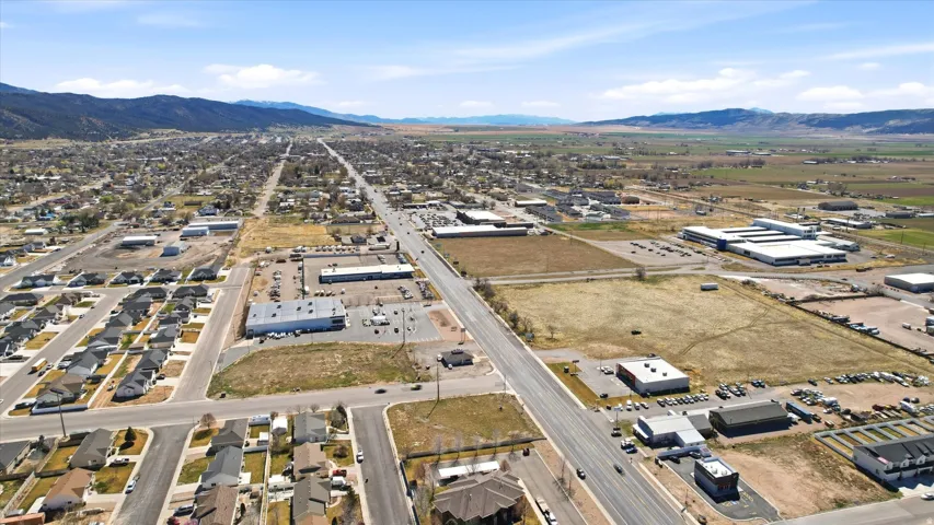 Aerial overview of property's location featuring a mountain backdrop