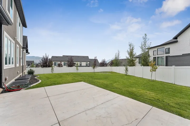 Fenced backyard featuring a patio area