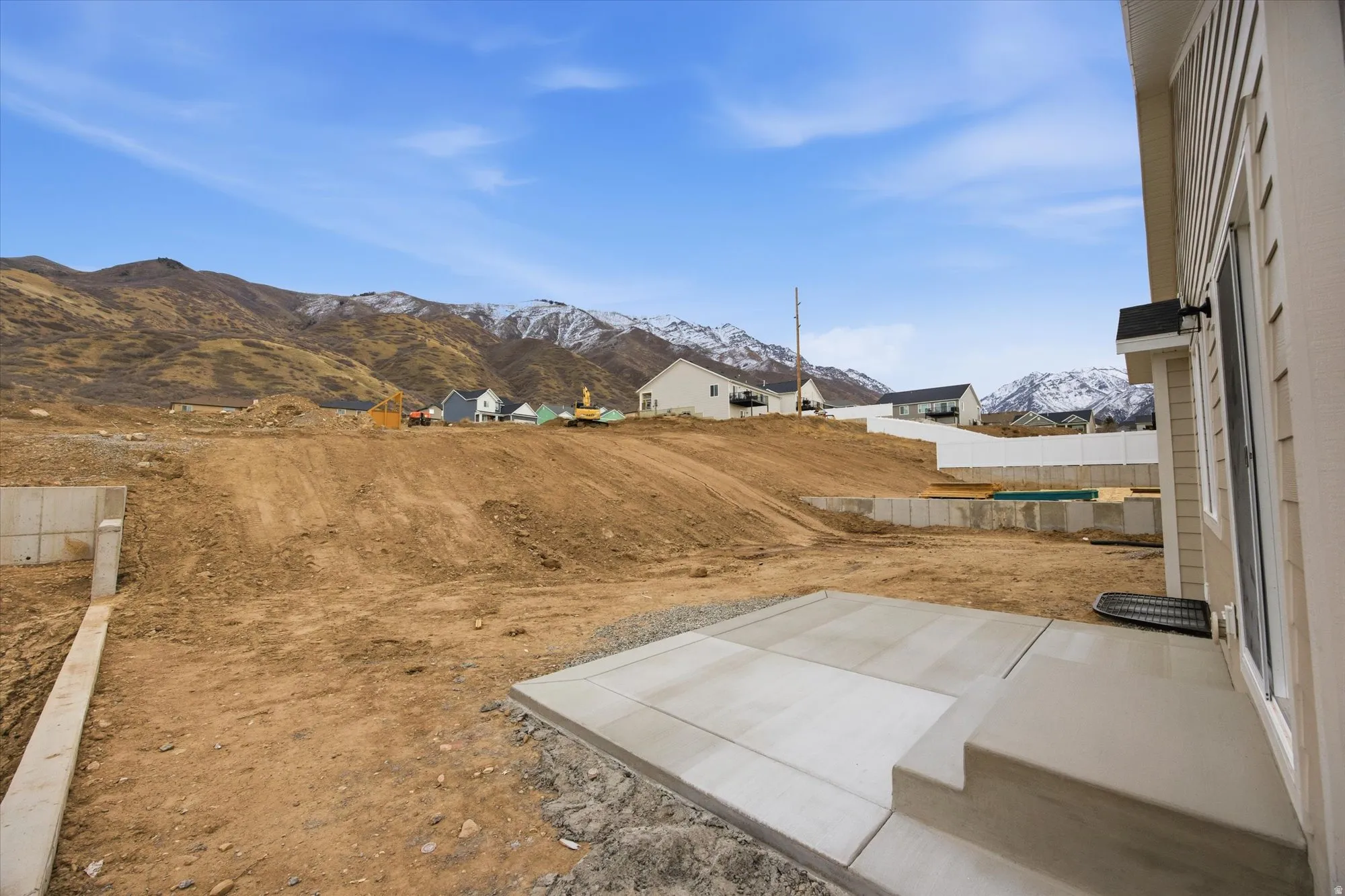 View of yard featuring a mountain view and a patio area