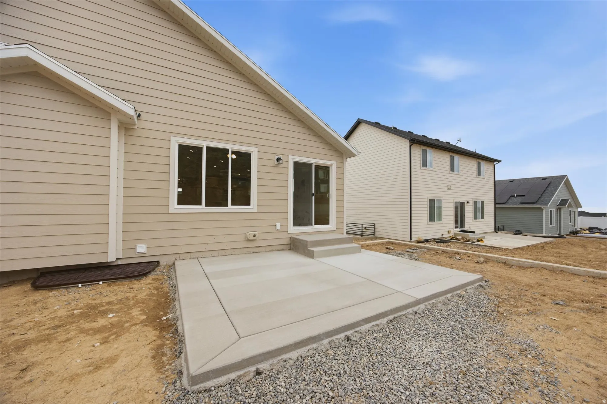 Rear view of property with a patio area and entry steps