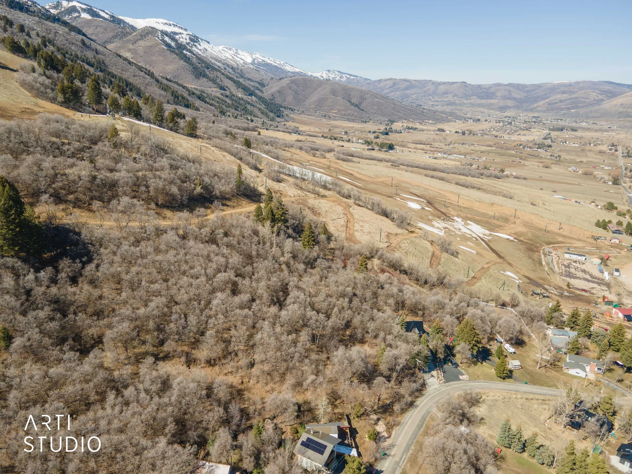 View of mountain backdrop with rural landscape
