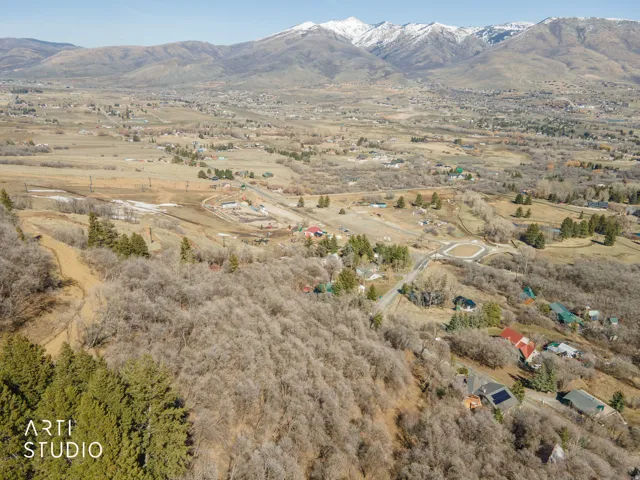 View of mountain backdrop featuring rural landscape