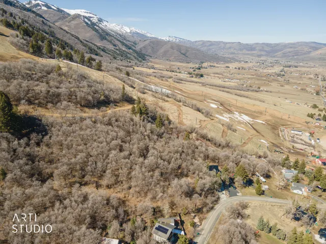View of mountain backdrop with rural landscape