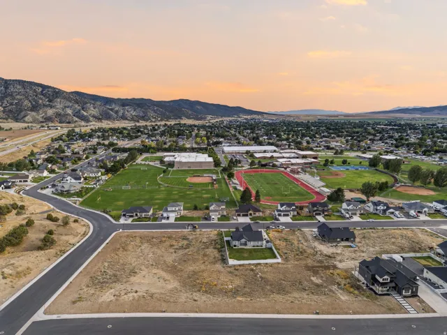 Residential development with paved streets and surrounding mountain landscape