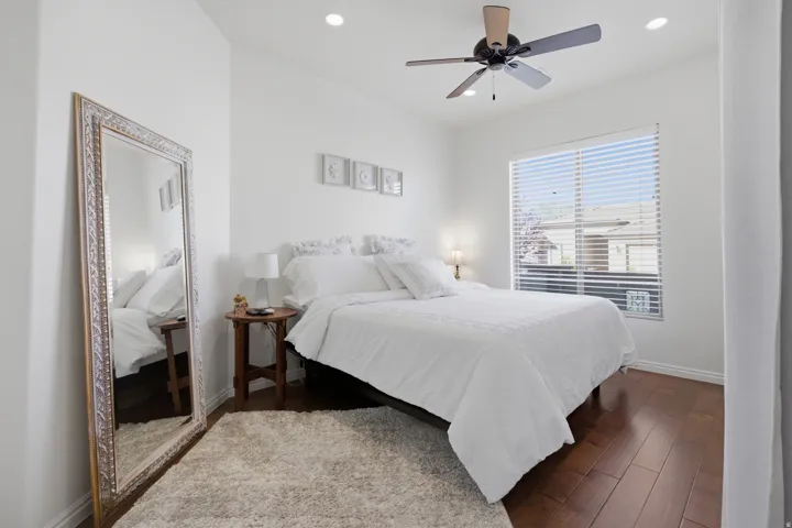 Bedroom featuring hardwood / wood-style floors, recessed lighting, and a ceiling fan