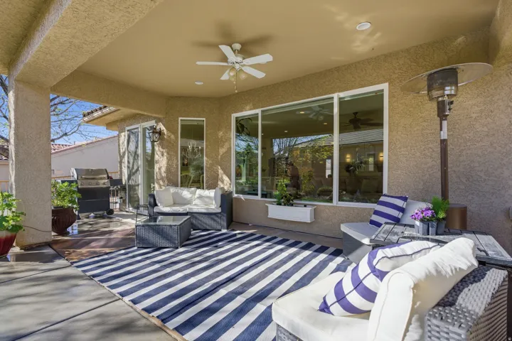 View of patio with an outdoor hangout area, a ceiling fan, and a grill