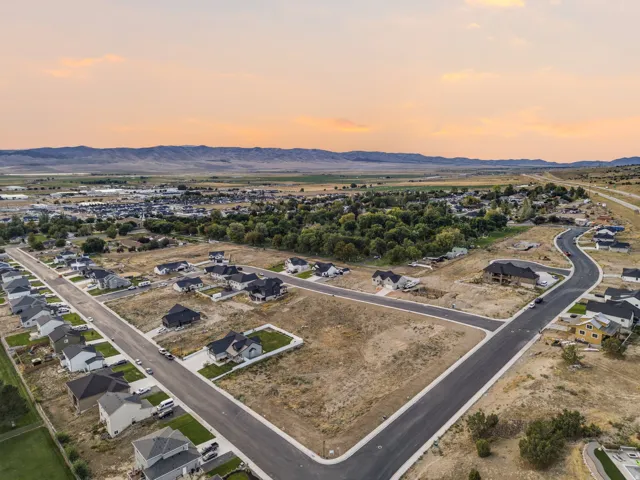New construction residential development featuring paved streets and mountain scenery
