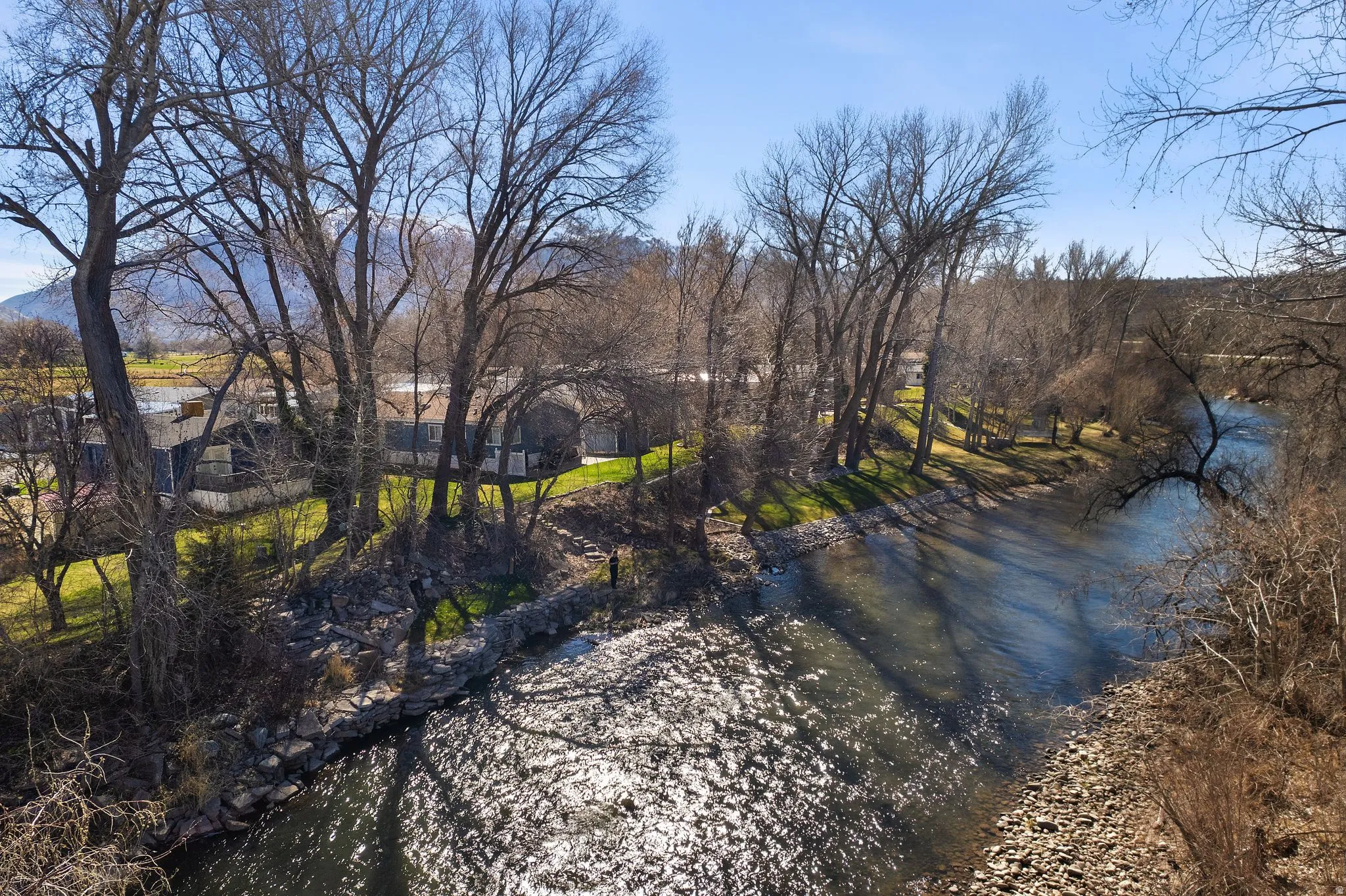 Water view with a tree filled landscape