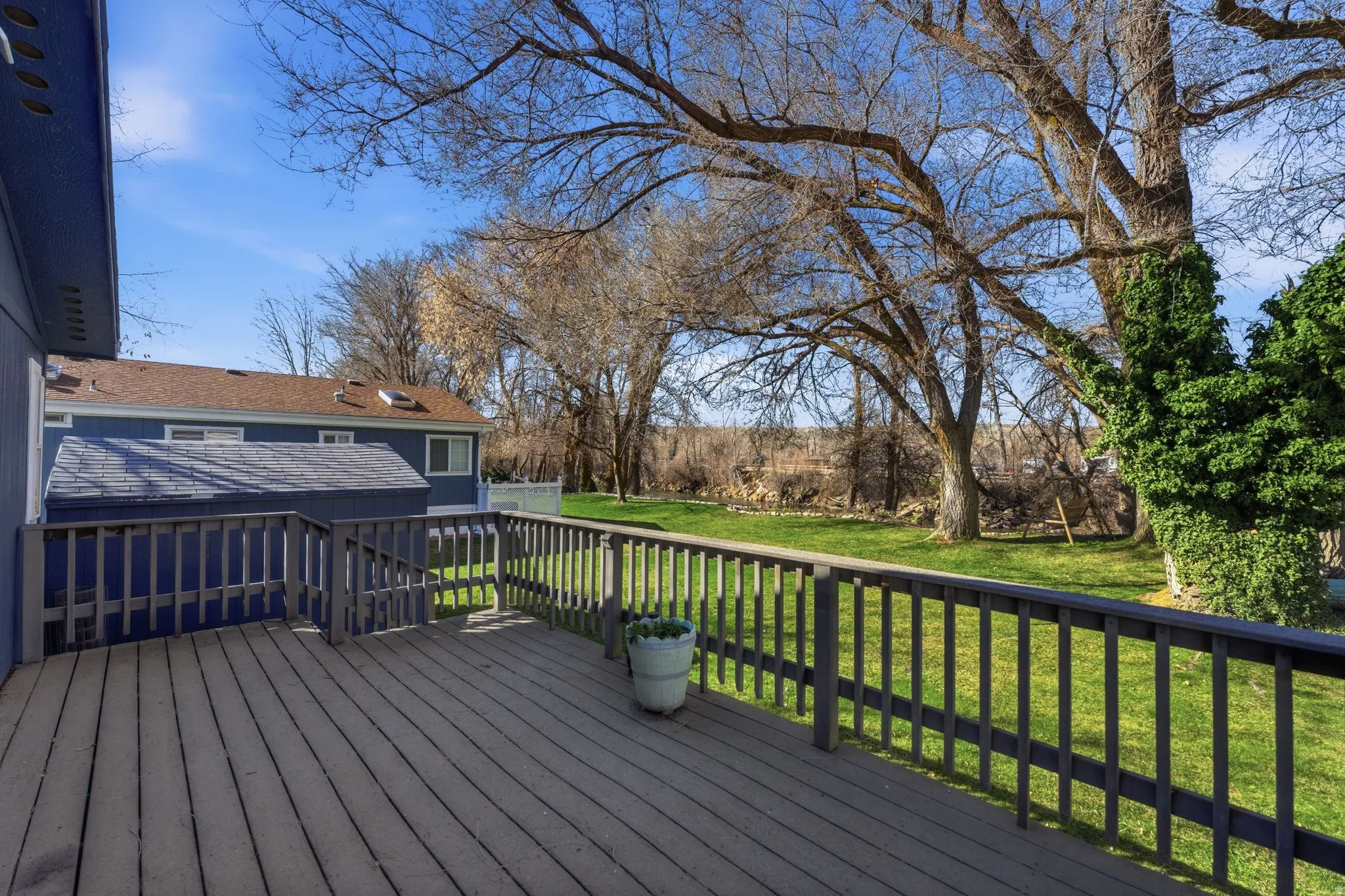 Wooden terrace with a lawn