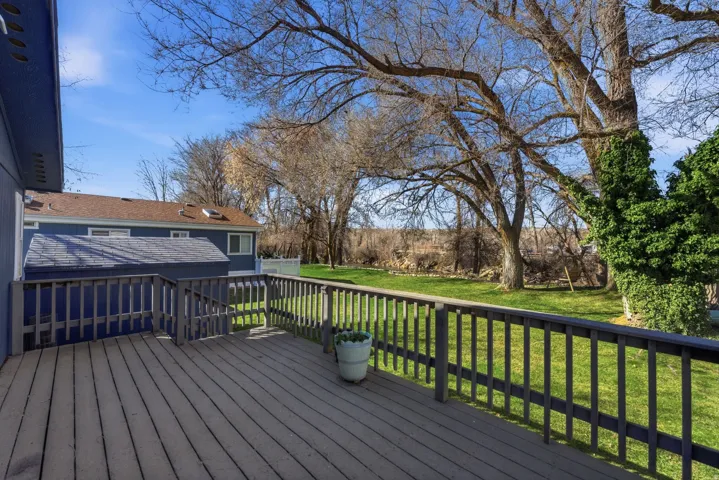 Wooden terrace with a lawn