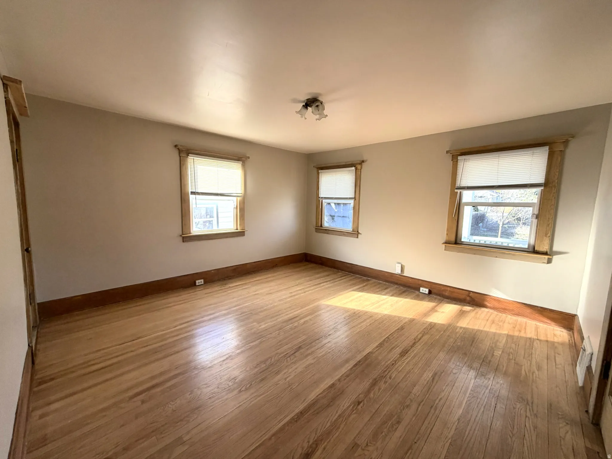 Master Bedroom featuring baseboards and hardwood / wood-style floors