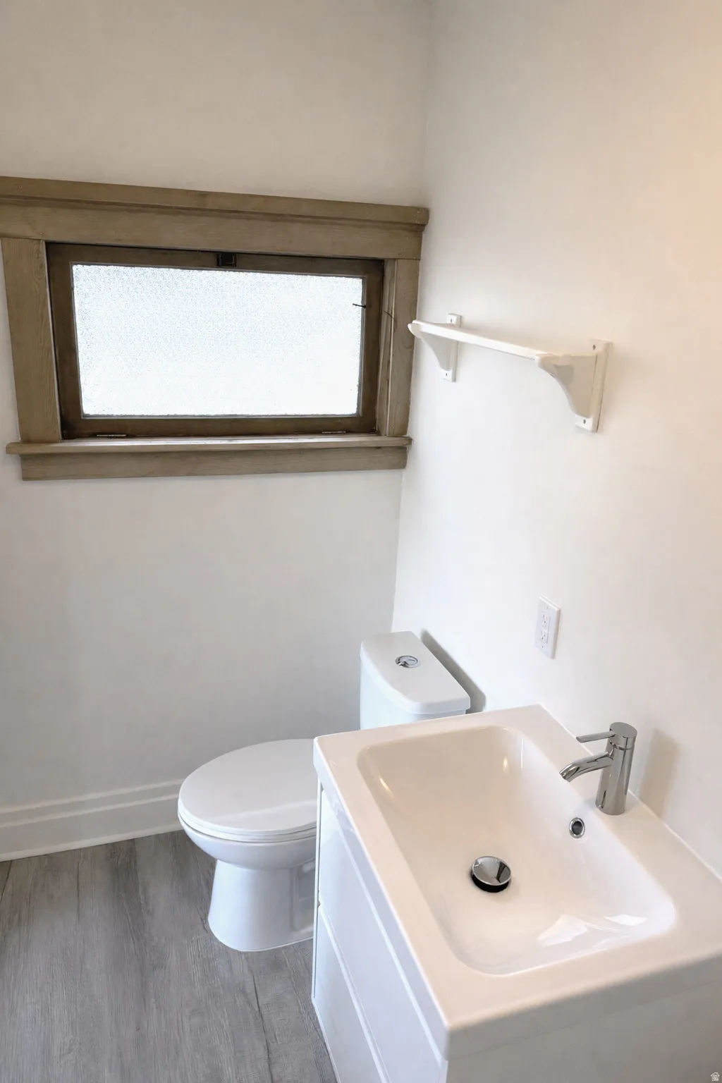 Bathroom with vanity and wood finished floors