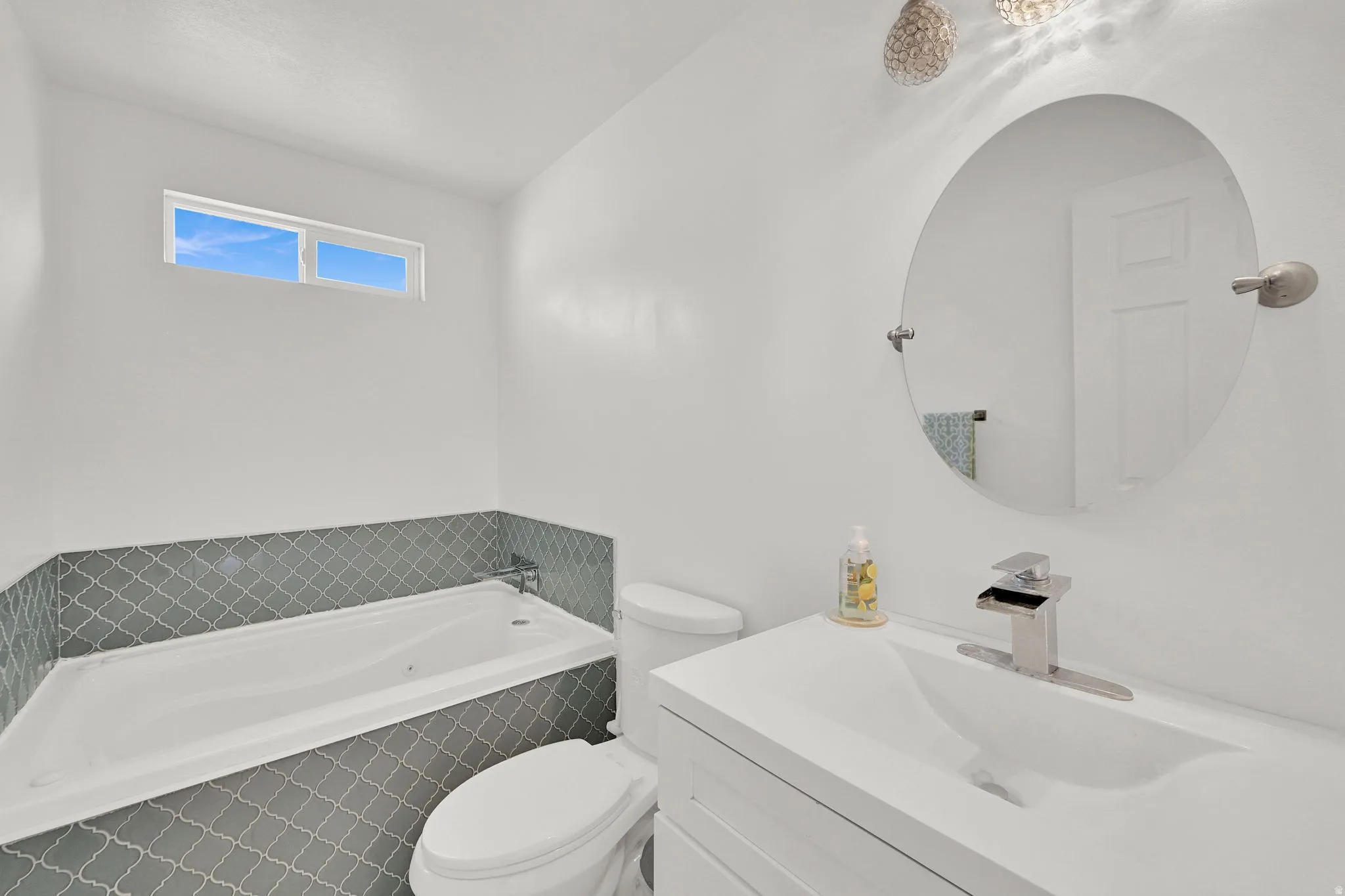 Update bathroom with a oversized jetted bath and vanity