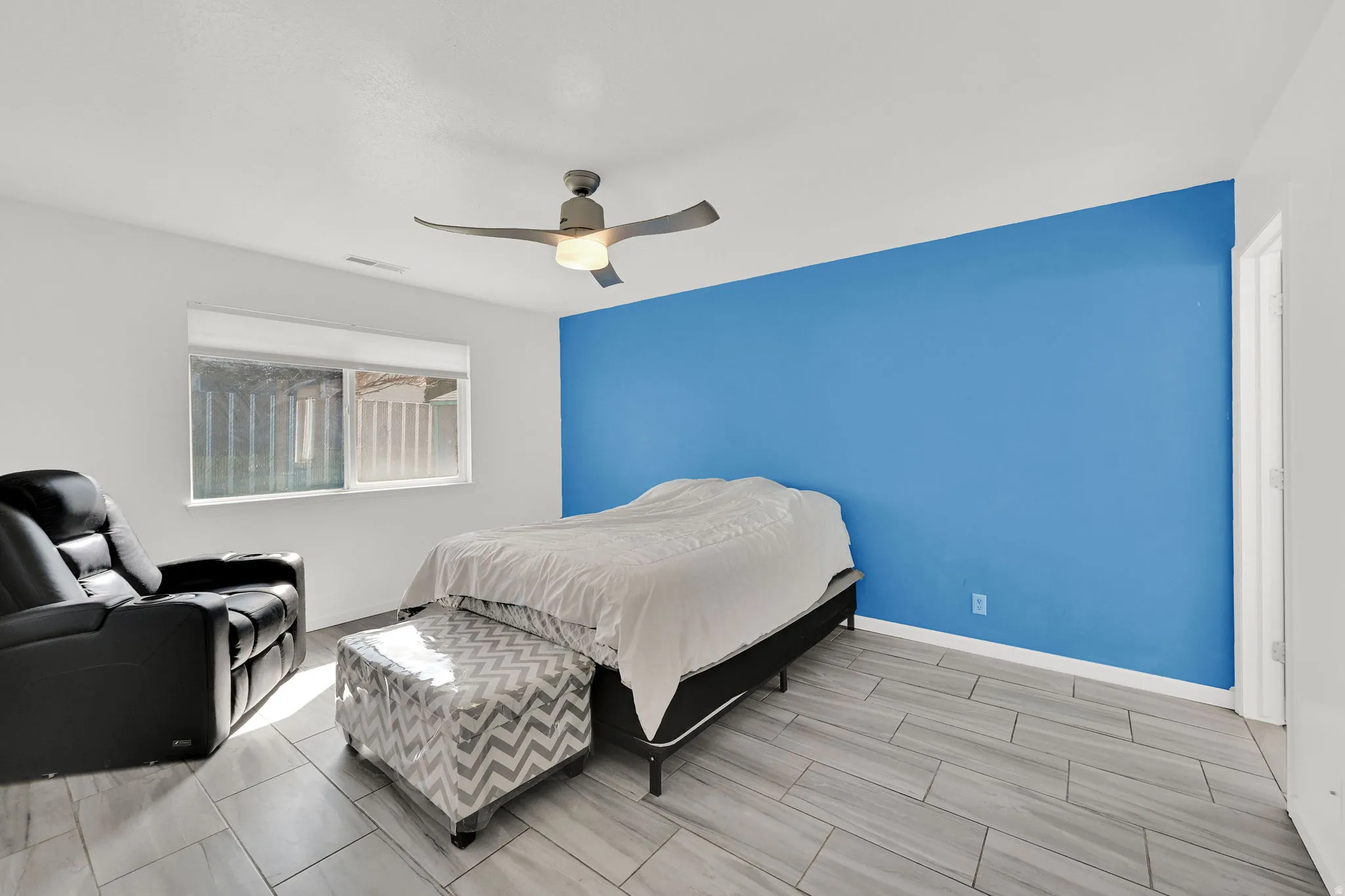 Master Bedroom featuring a ceiling fan tiled floors