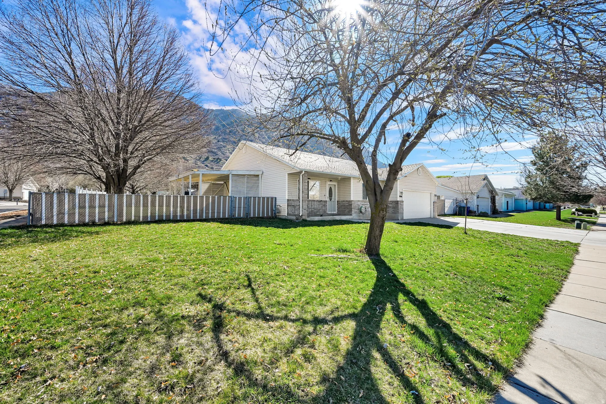 View of front of home featuring an attached garage and driveway