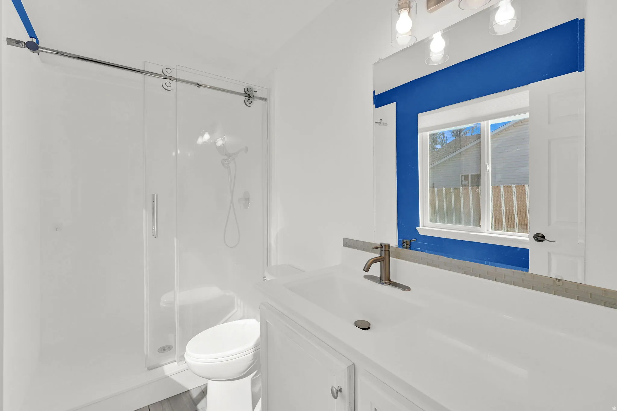 Master Bathroom with vanity and a walk in shower