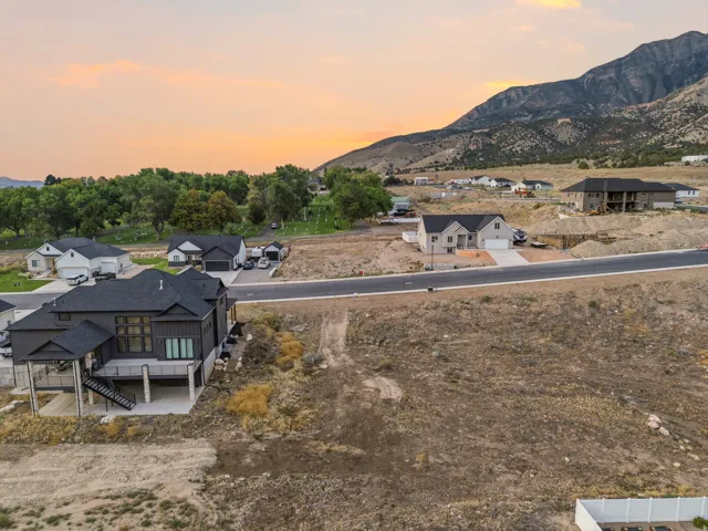 Modern-style residence with a dark exterior and covered patio