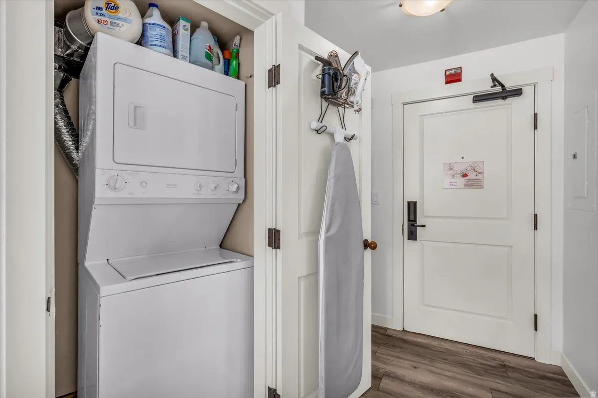Laundry area featuring stacked washer / dryer