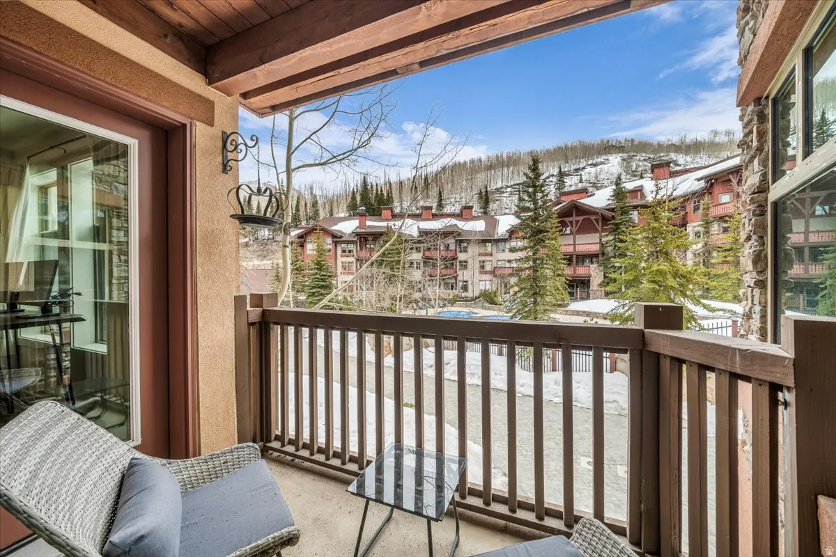 View of snow covered back of property