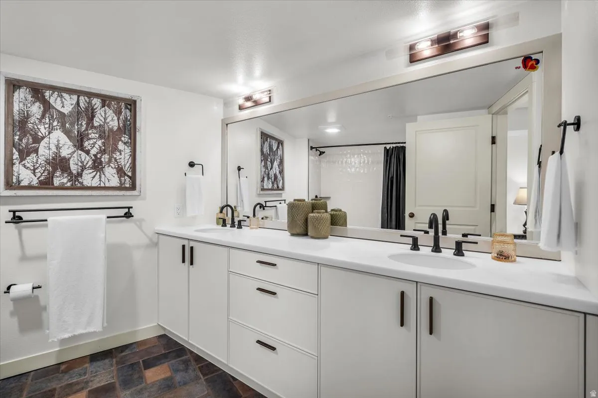 Full bathroom with double sinks