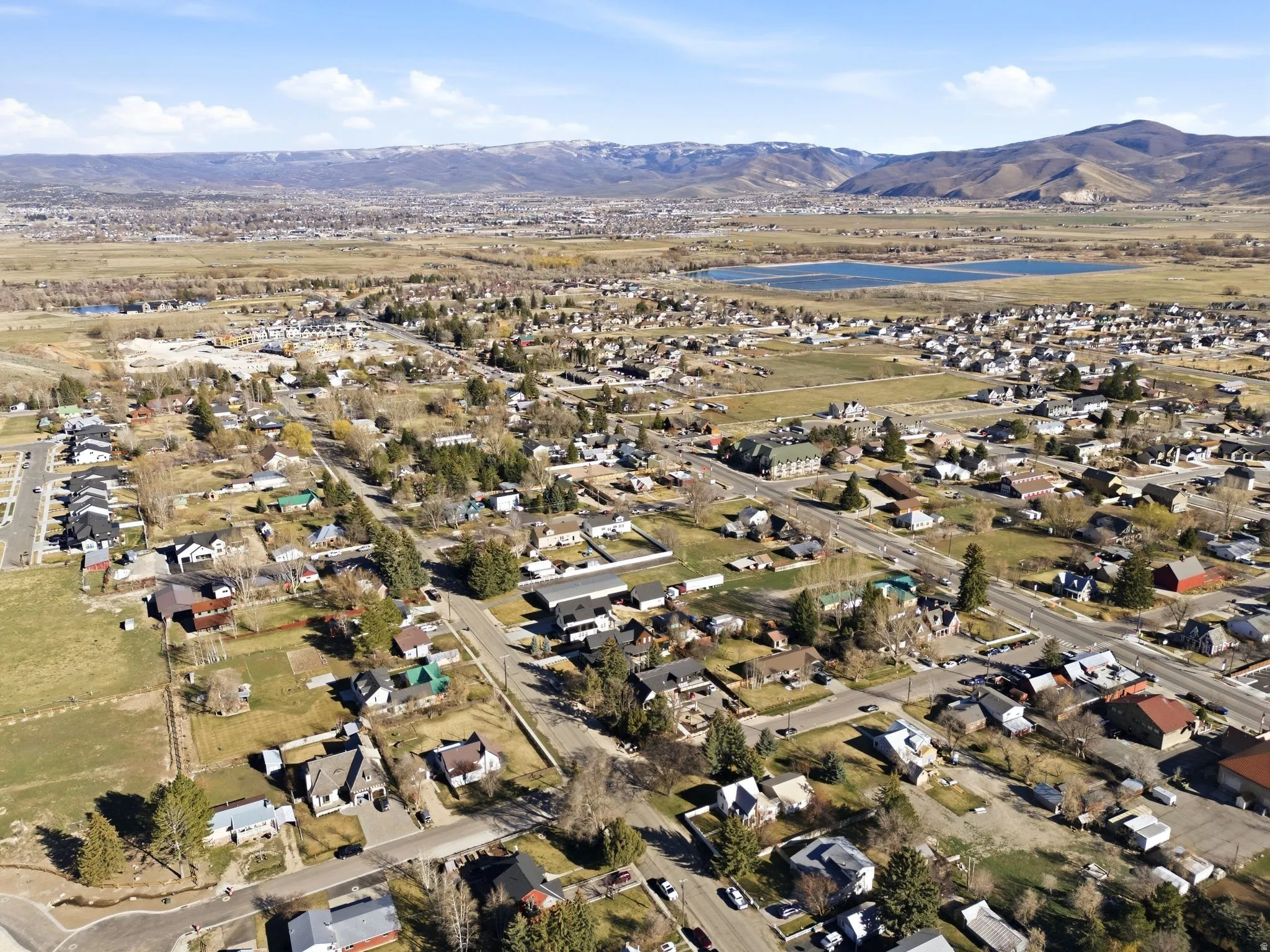 Aerial view of residential area featuring a mountainous background