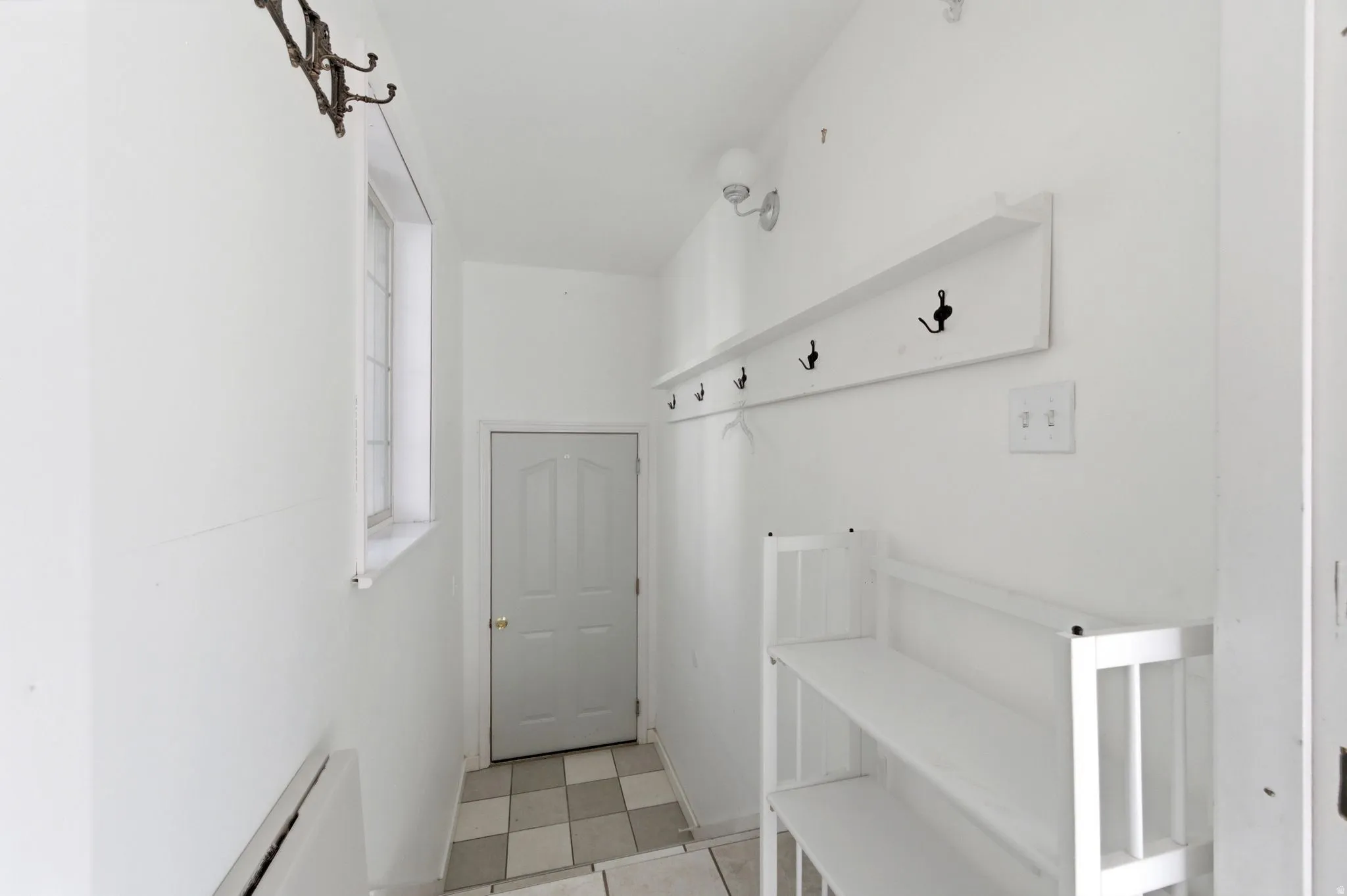 Mudroom with a baseboard radiator