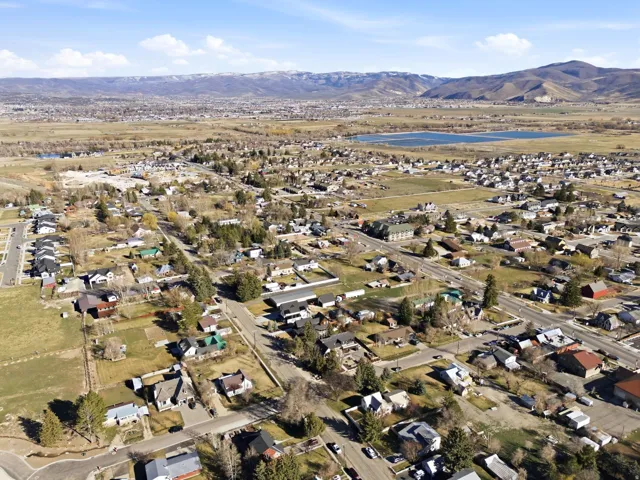Aerial view of residential area featuring a mountainous background