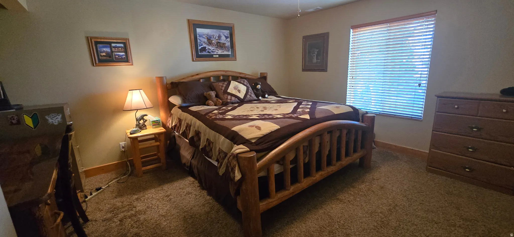 Bedroom featuring dark colored carpet
