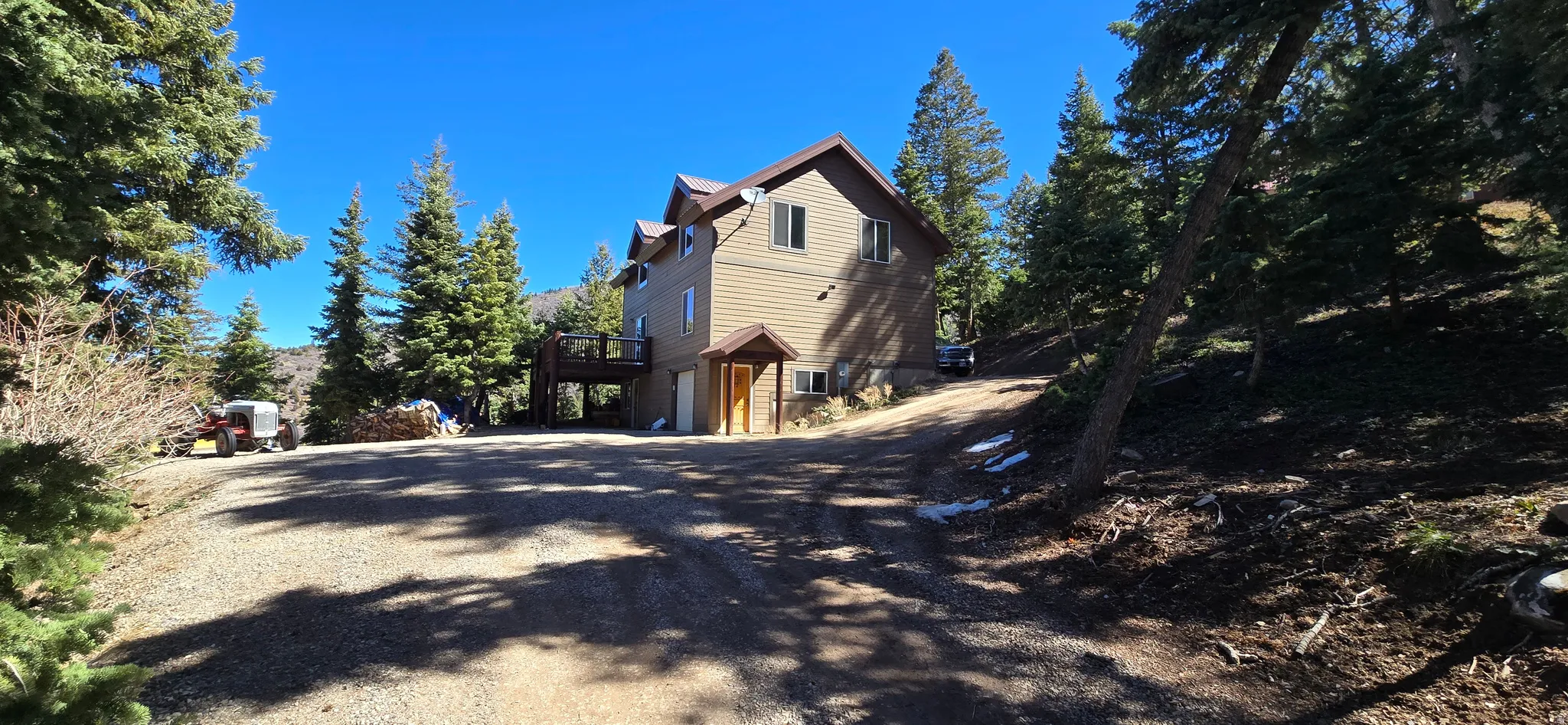 View of property exterior featuring driveway and a garage