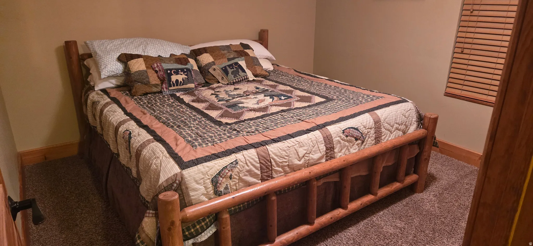 Carpeted bedroom with baseboards