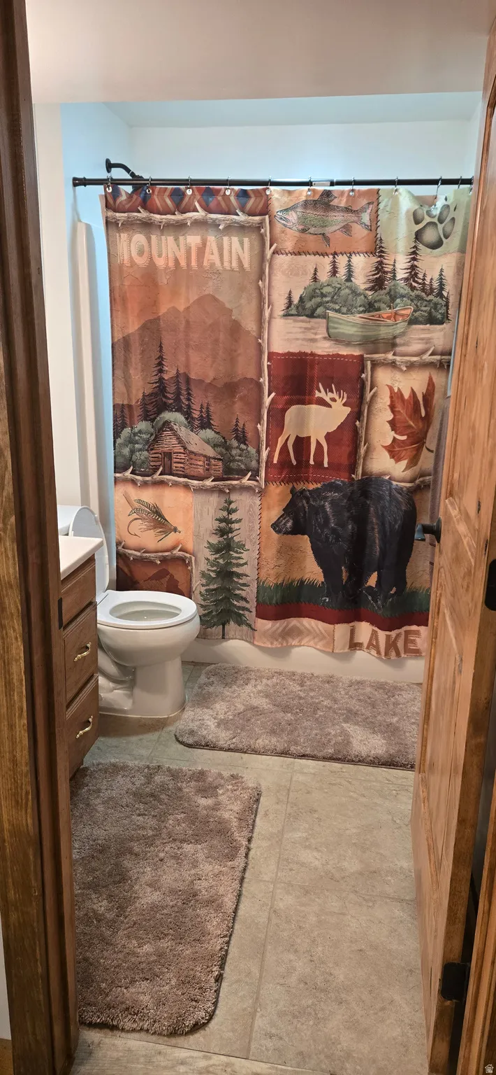 Full bath featuring vanity and toilet