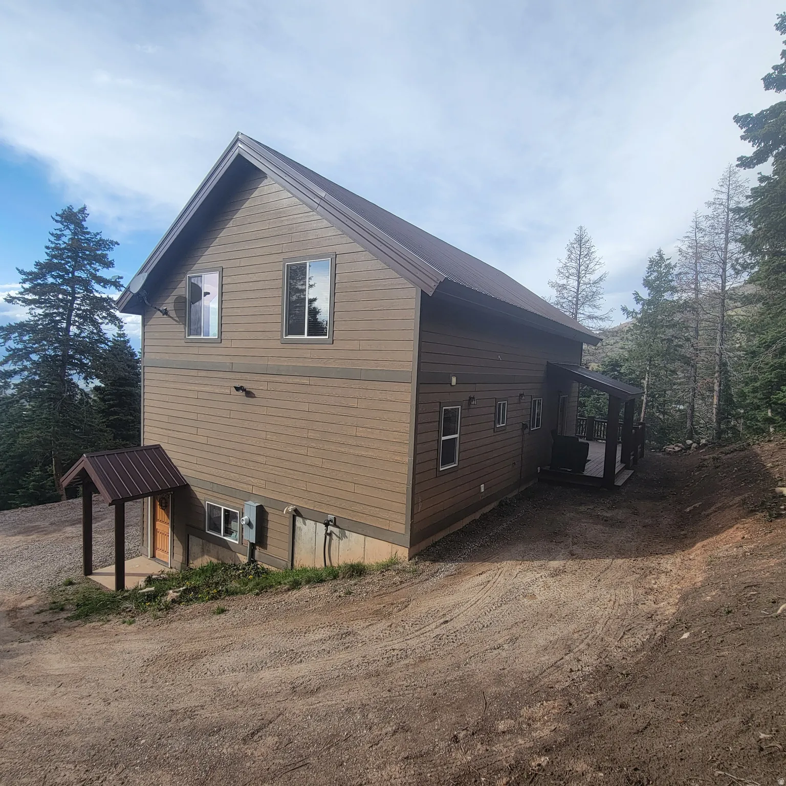 View of side of home with driveway