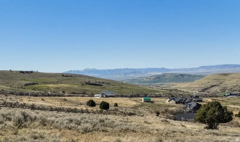 View of mountain backdrop with rural landscape