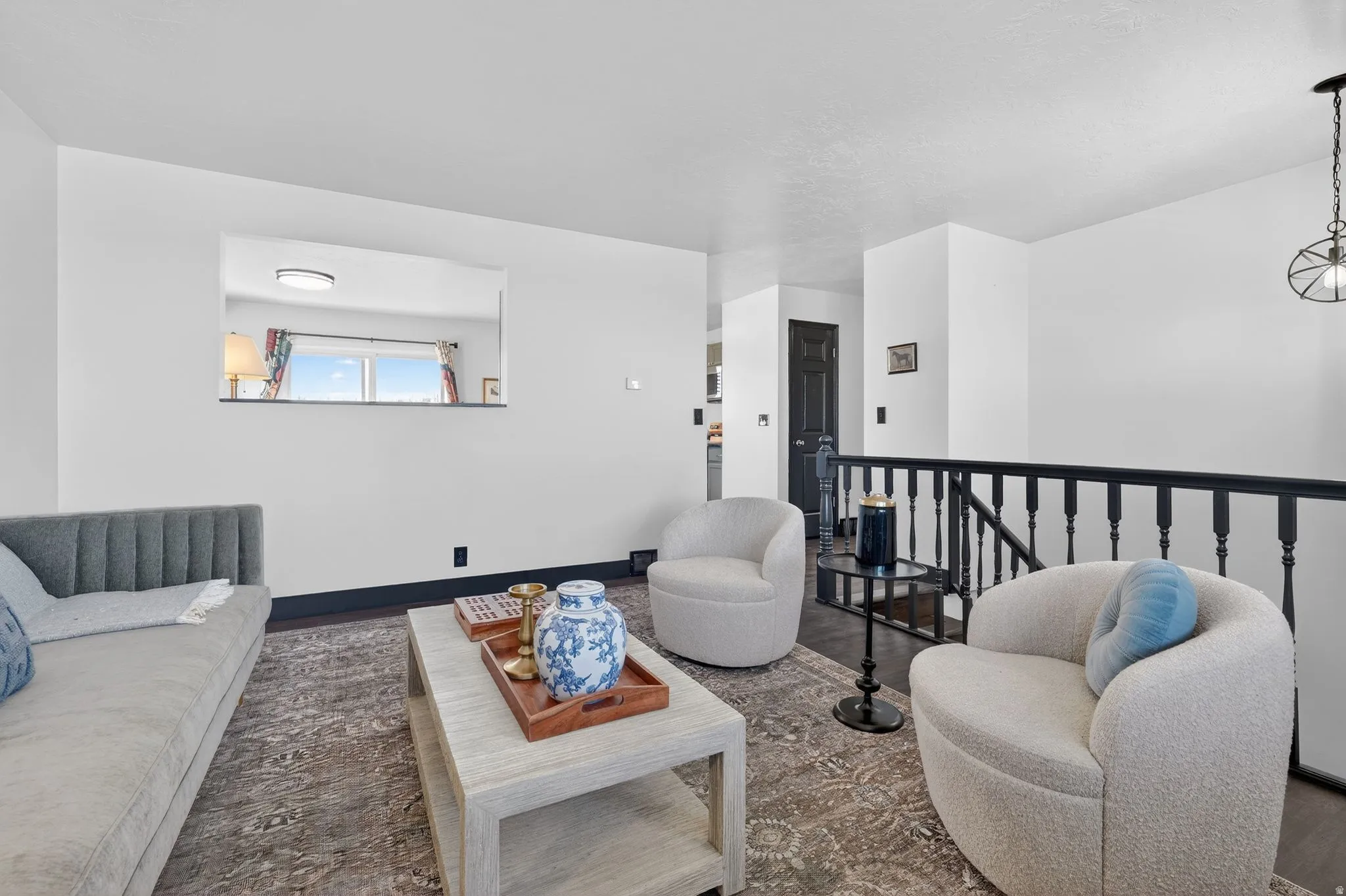 Living room with wood finished floors and baseboards