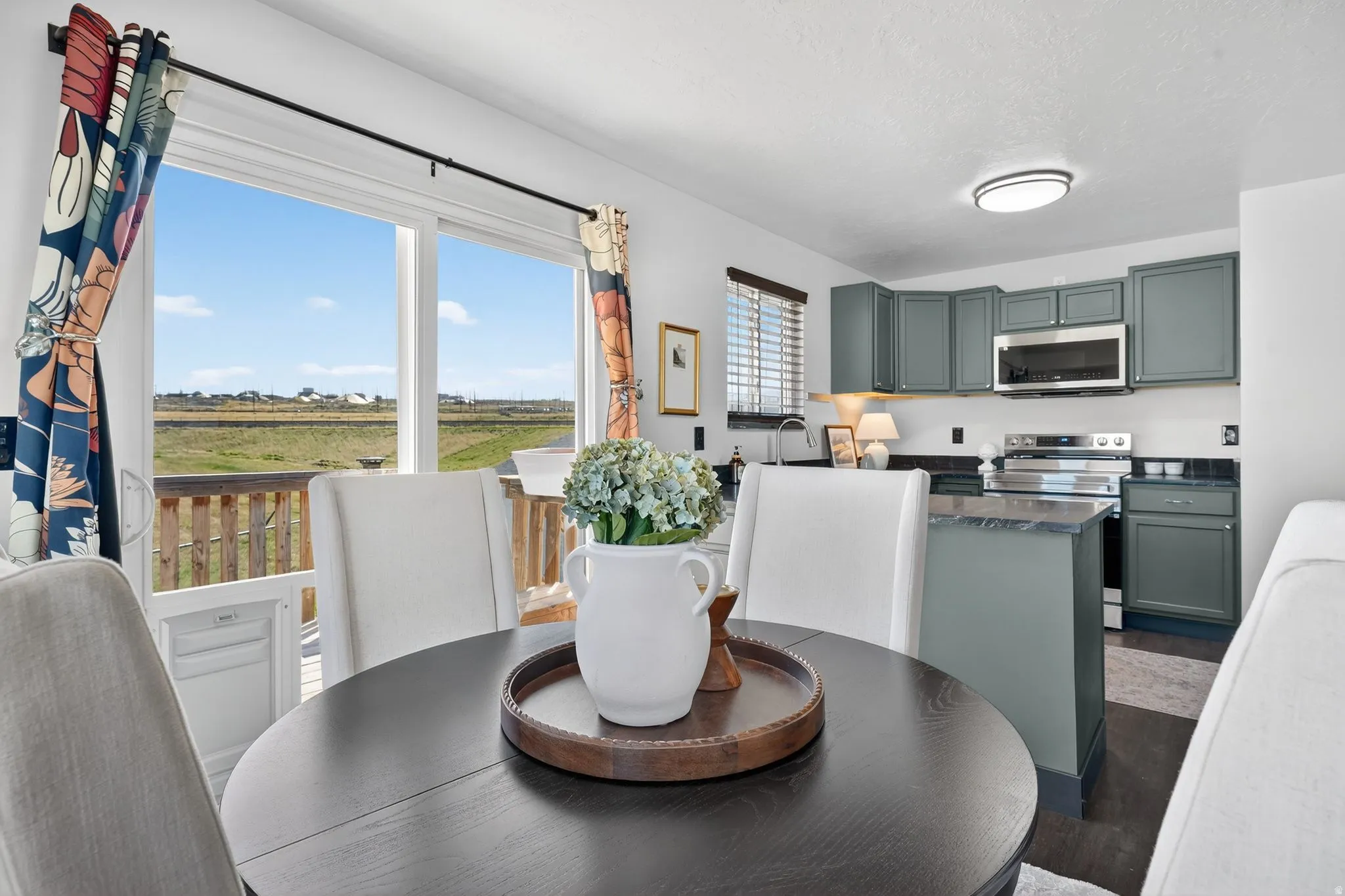 Dining area featuring dark wood-type flooring