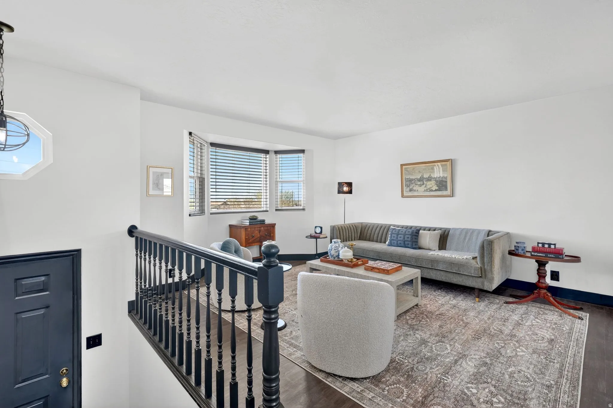 Living area featuring wood finished floors and baseboards