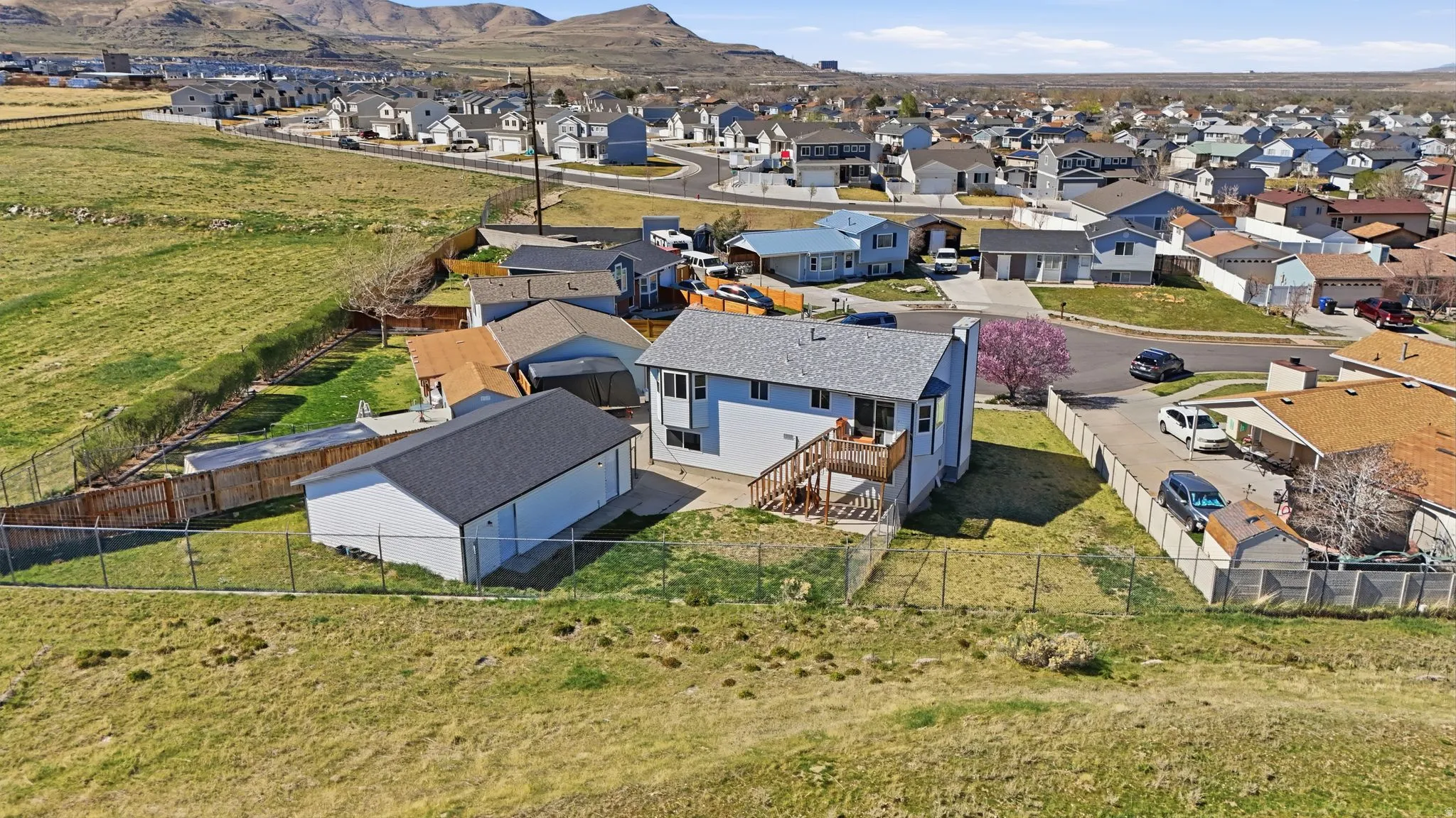 Aerial perspective of suburban area featuring a mountain backdrop