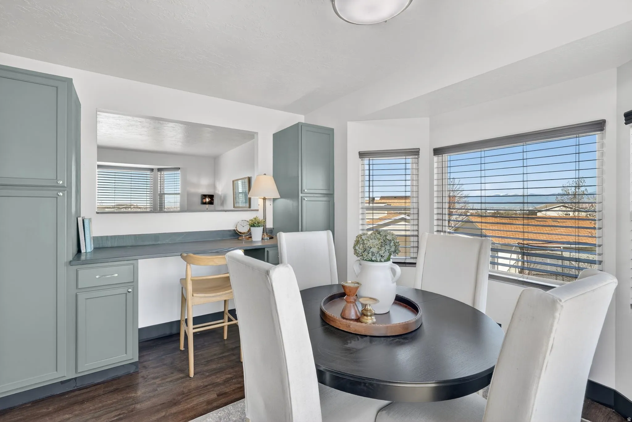 Dining space featuring dark wood-style floors