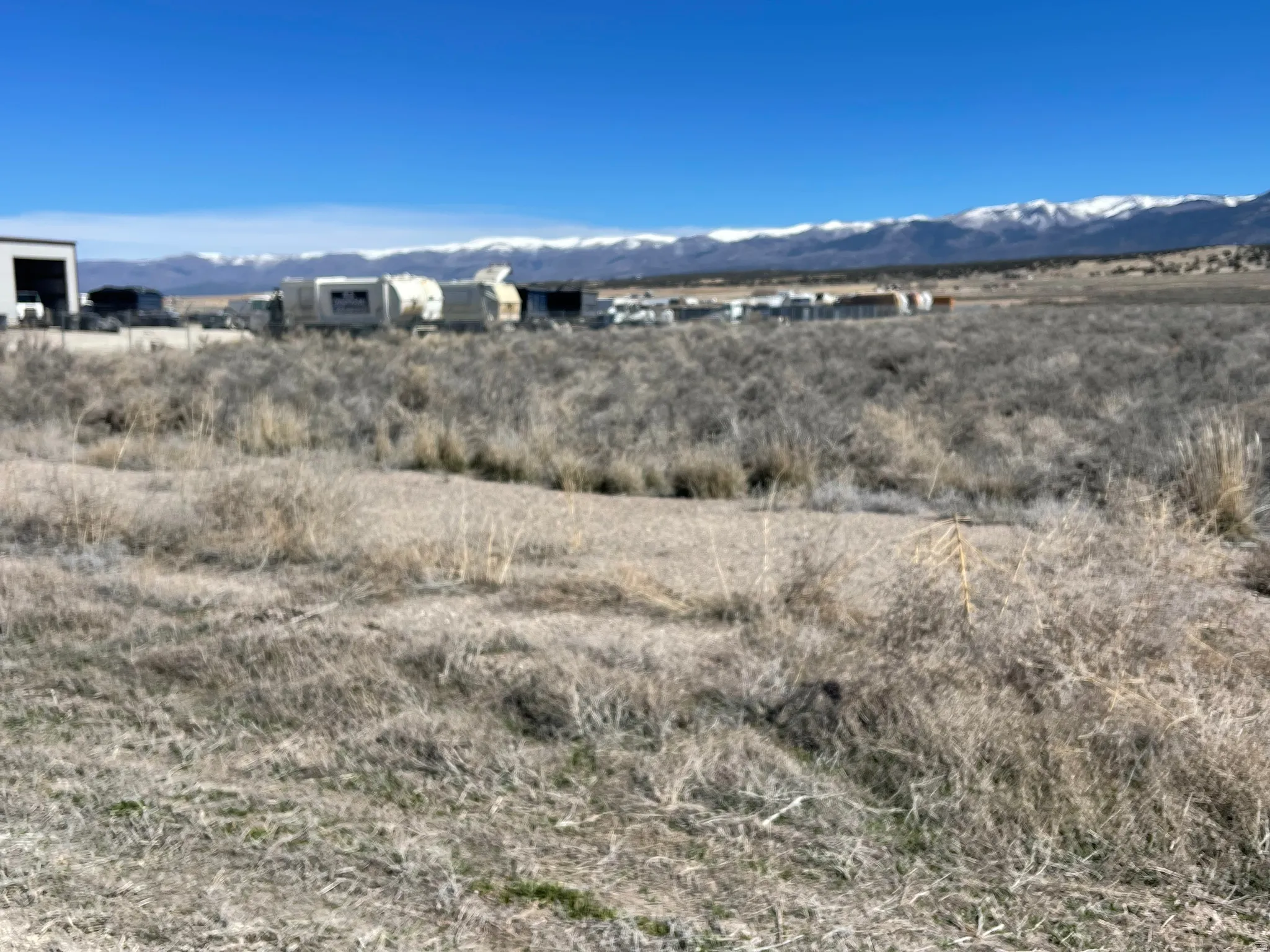 View of mountain backdrop with rural landscape